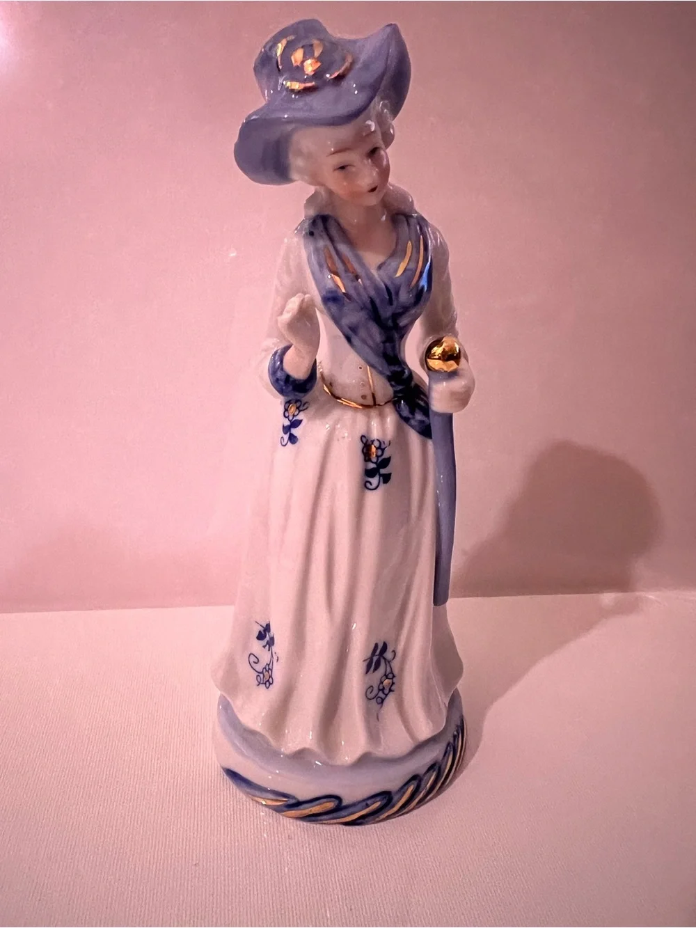 Vintage Porcelain Lady Figurine in White and Light Blue with Gold Accents